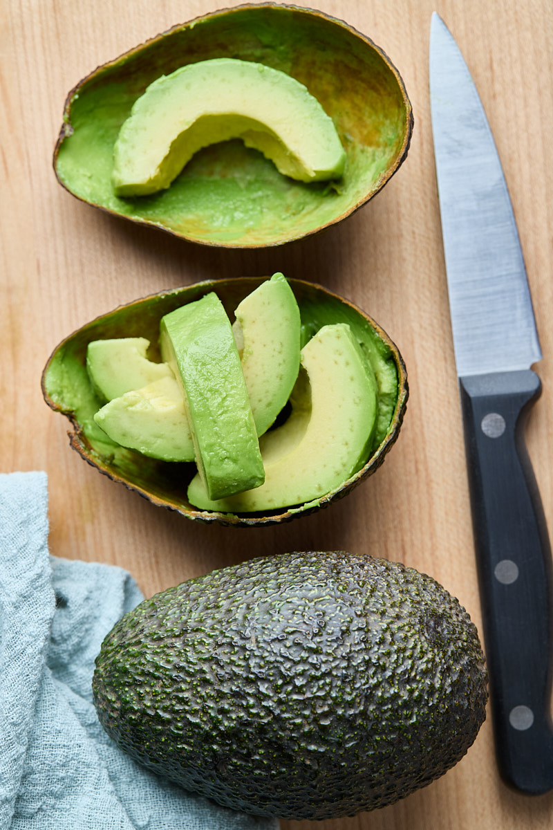 Cut avocado for making smoothies.