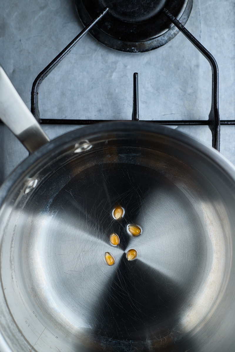 Drop a few kernels into the oil.