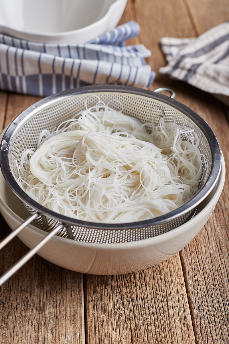 Drain rice noodles in a strainer.