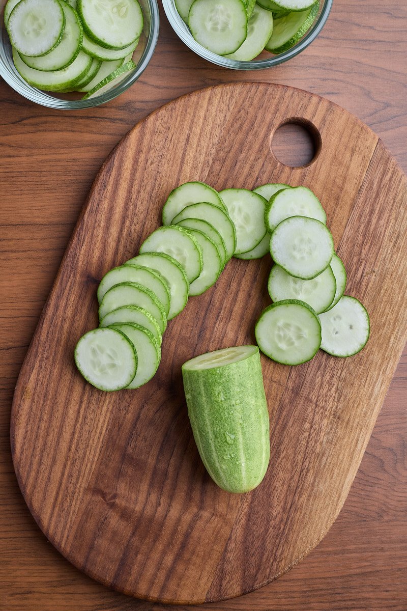 Malk cucumber shiny and slice thin.