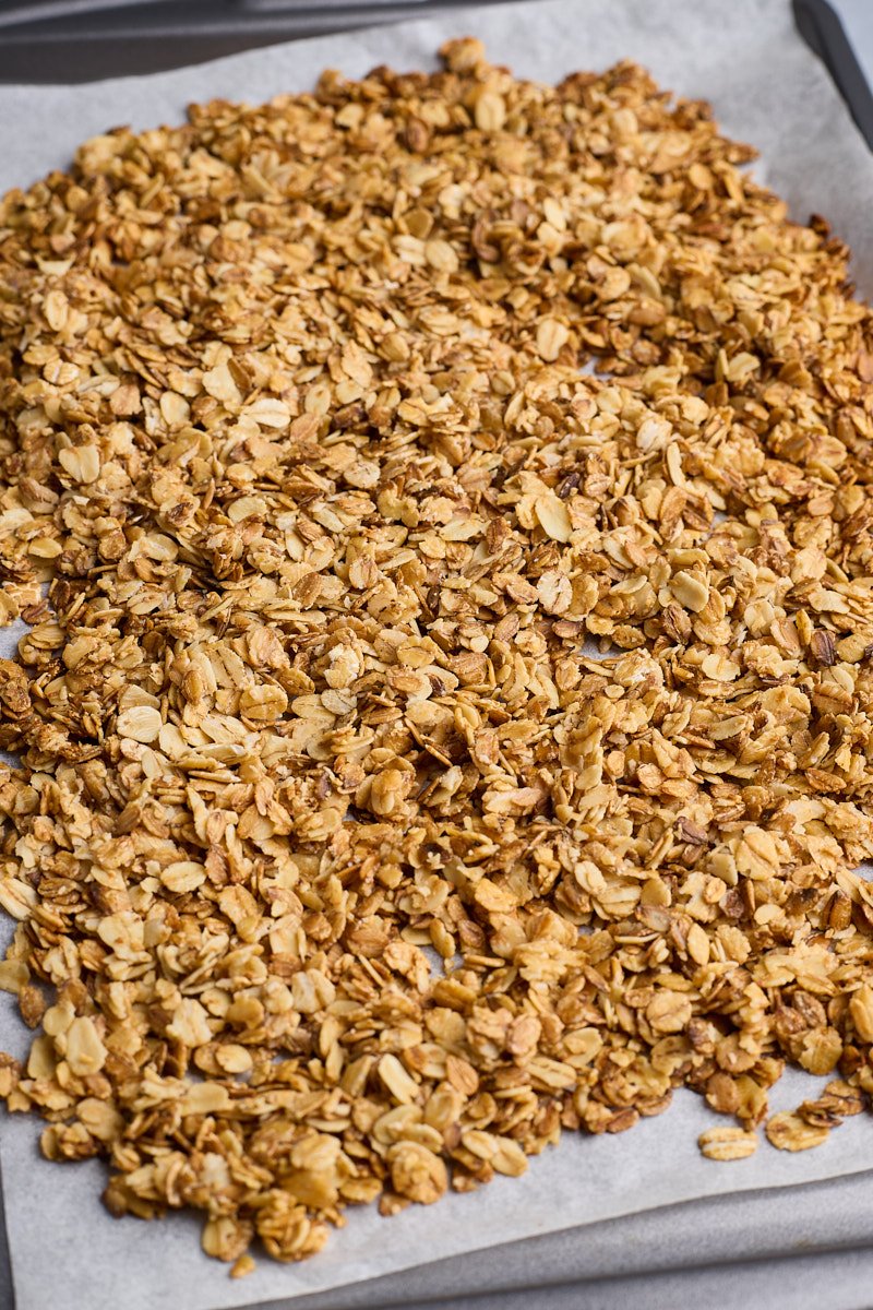 Spread the oat mixture onto rimmed baking sheet and bake until toasted.