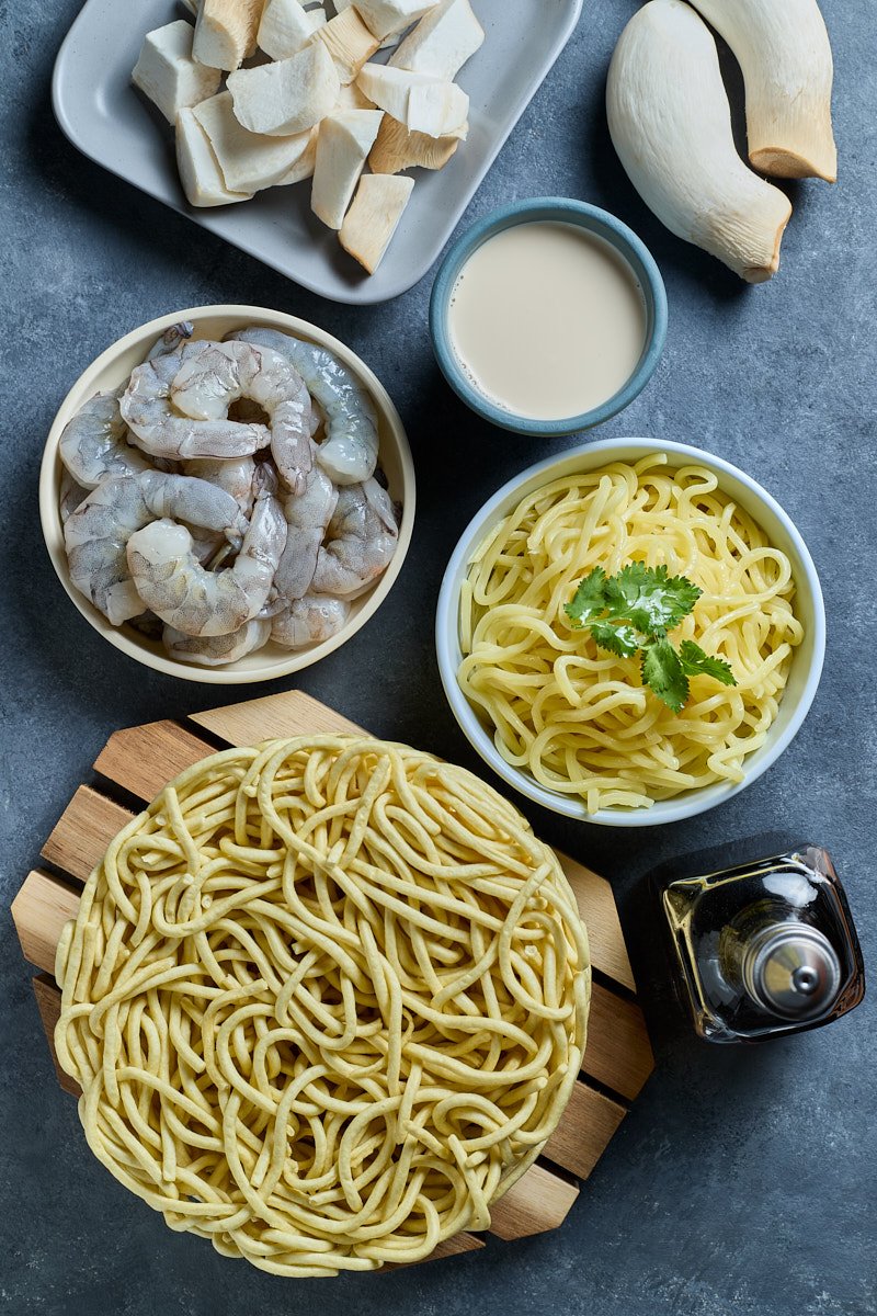 Take on creamy Tom Yum soup with shrimps, mushrooms, and noodles.