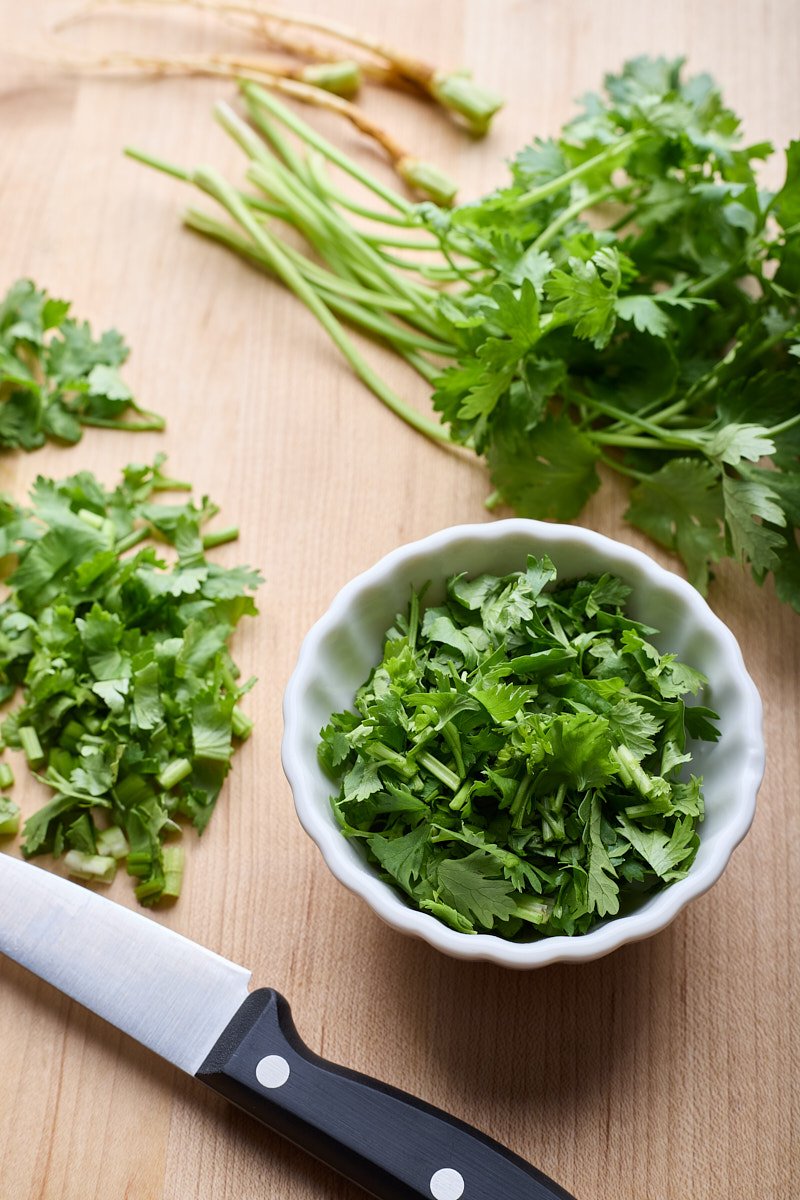 Chop coriander for cooking or garnish.