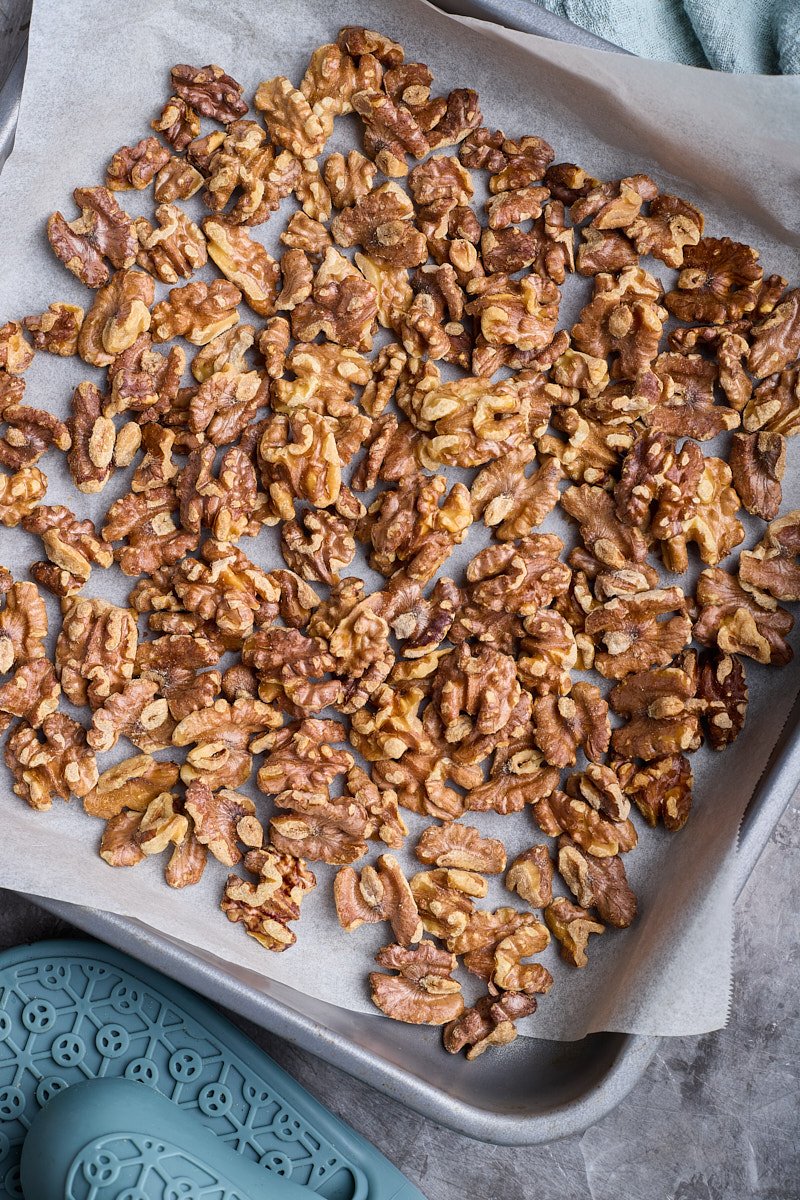 Spread the nuts on the baking sheet and bake.