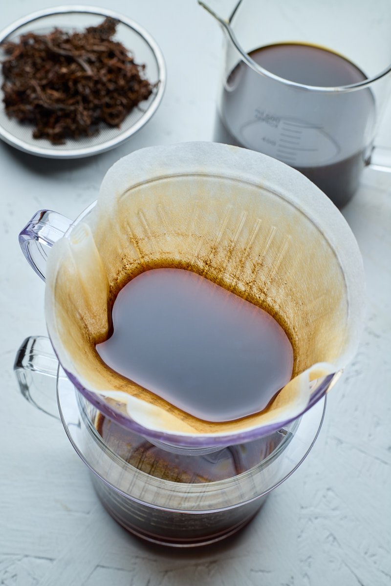 Strain the tea dust left with paper coffee filter.