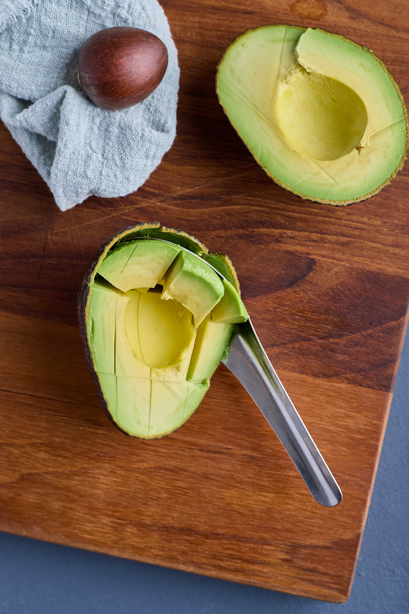 Halve avocado remove pit and cut into chunks.