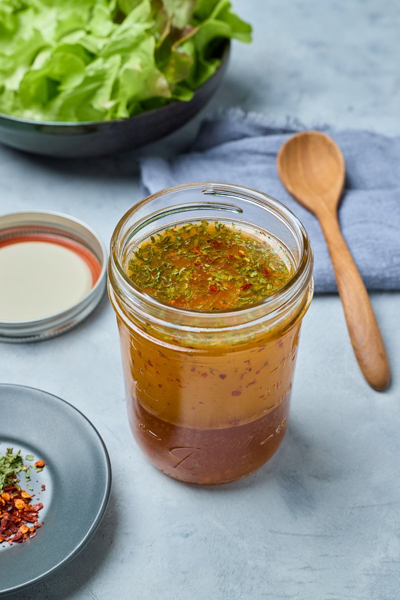 Vinegar is combined tangy dressing.