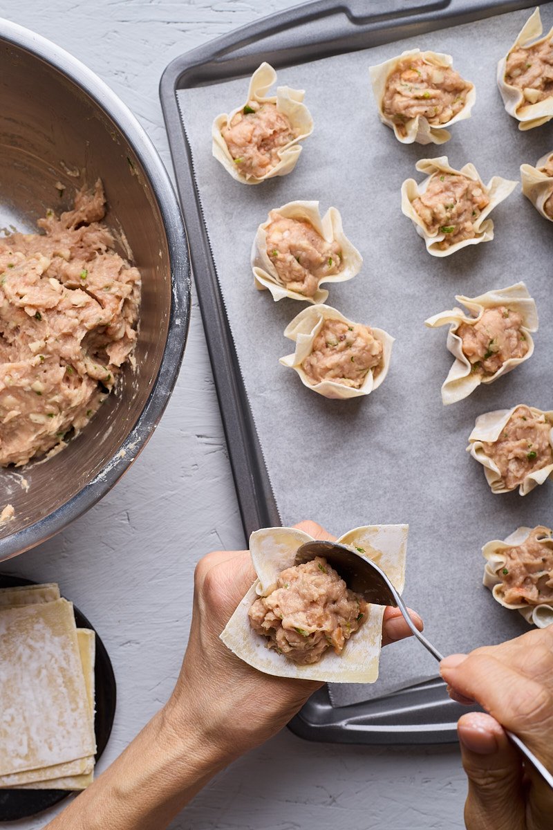 Shape dumpling by placing wrapper on your hand.