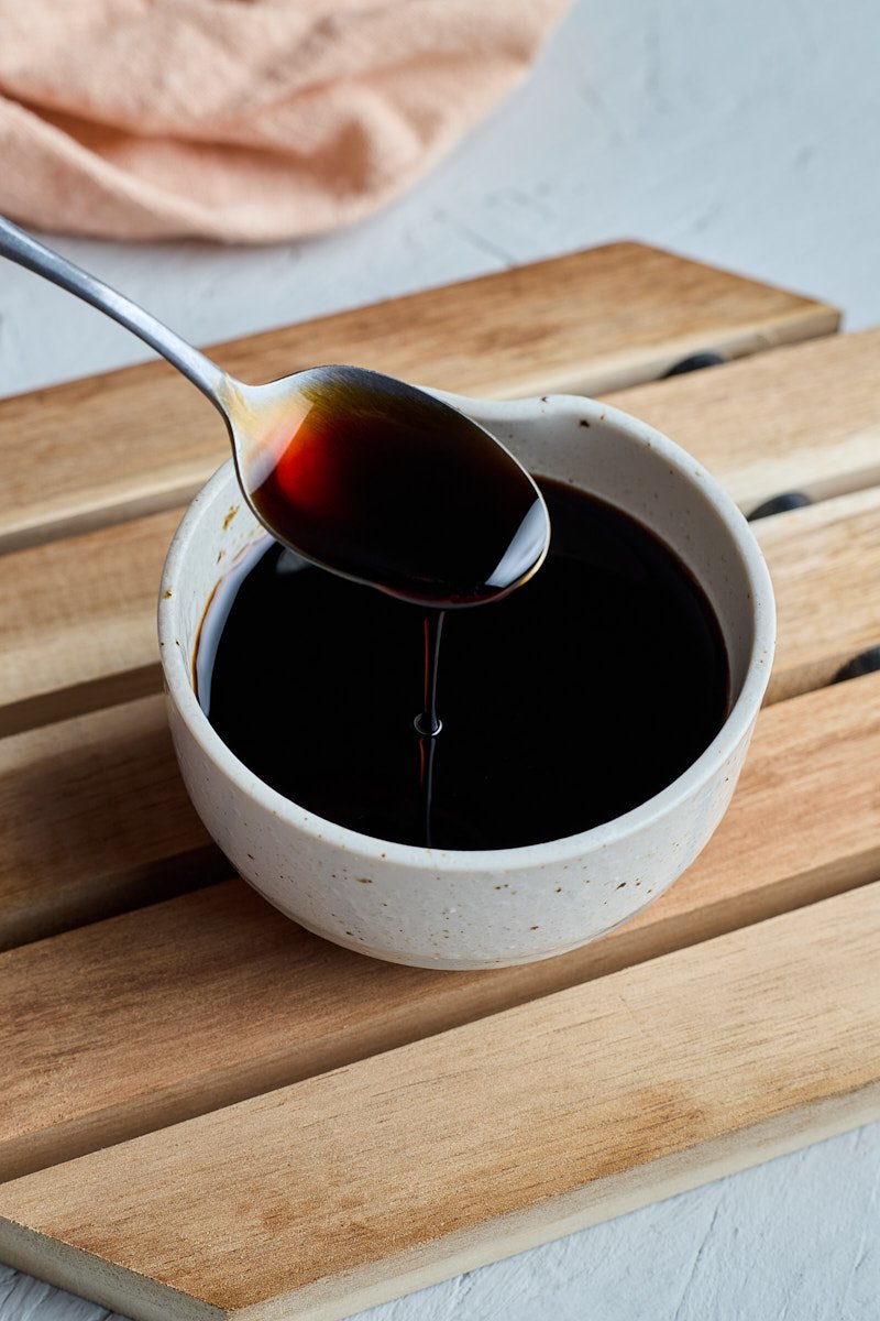 Sweet soy sauce for dipping is show to the side like honey.