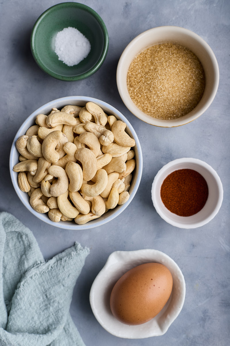 Prep raw cashew nuts and spice ingredients.