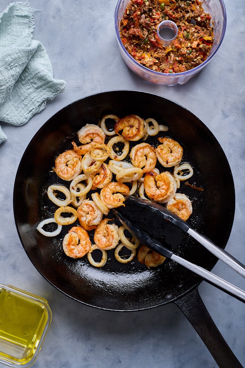 Cook shrimp and squid until brown.