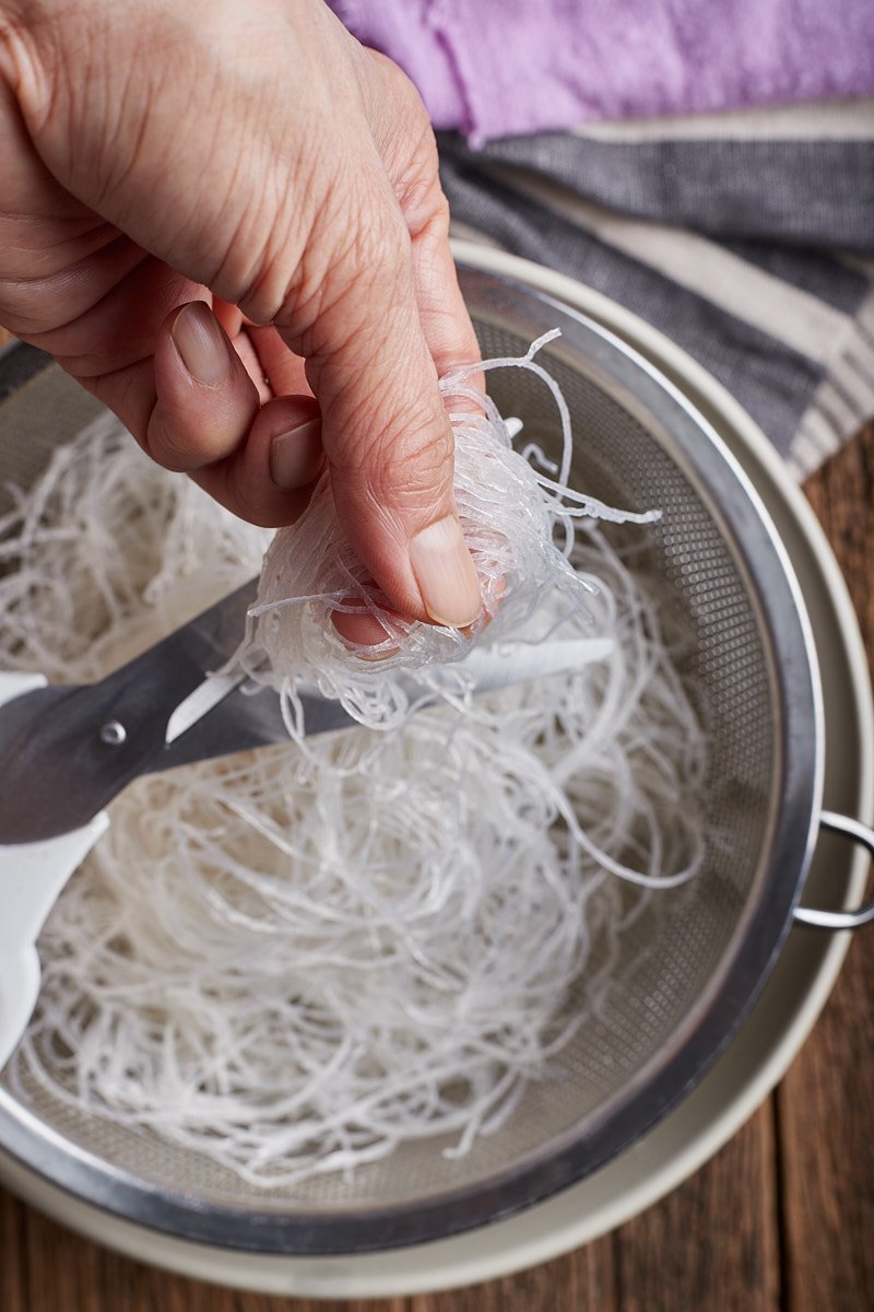 Drain and use scissors to snip the glass noodles in to roughly.