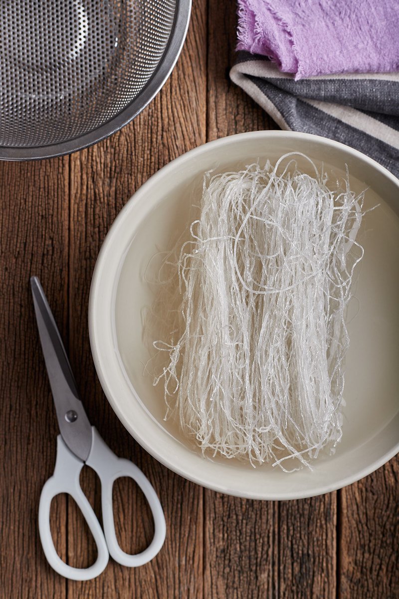 Place glass noodles in a small bowl and cover with water.