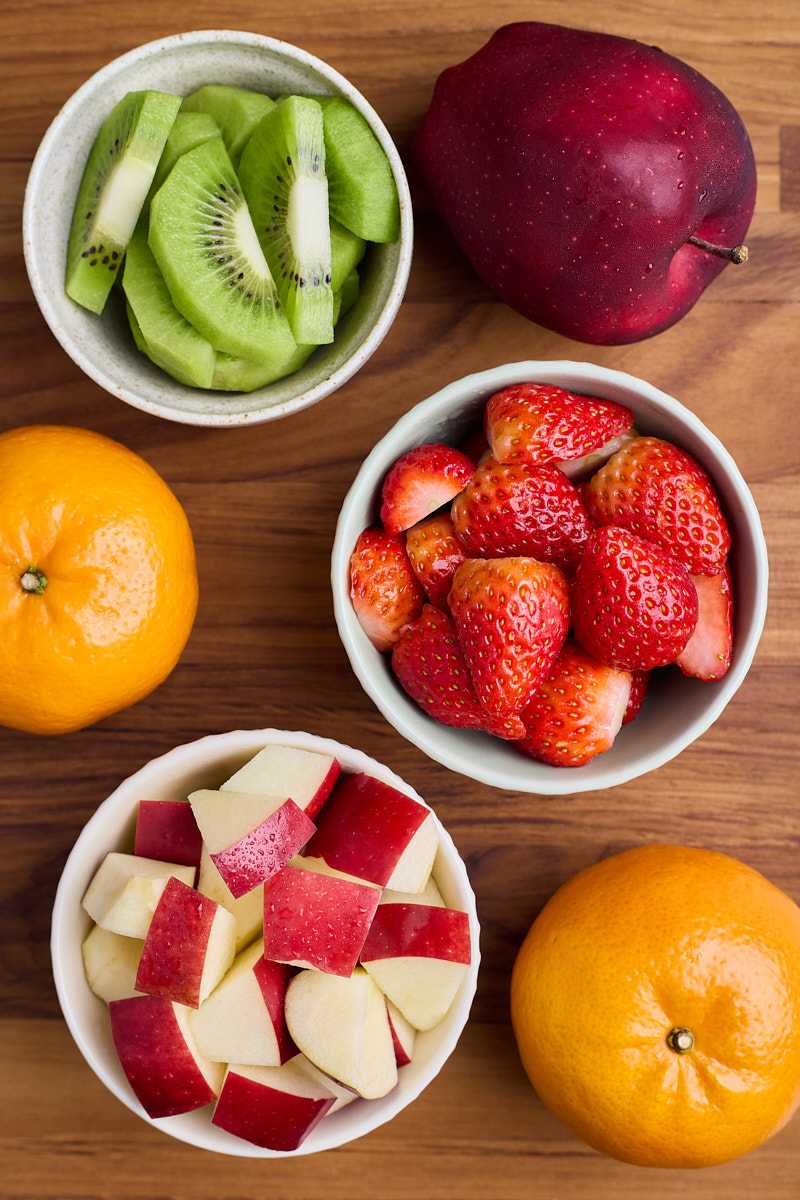 Peel and slice fruits place in a small bowl.